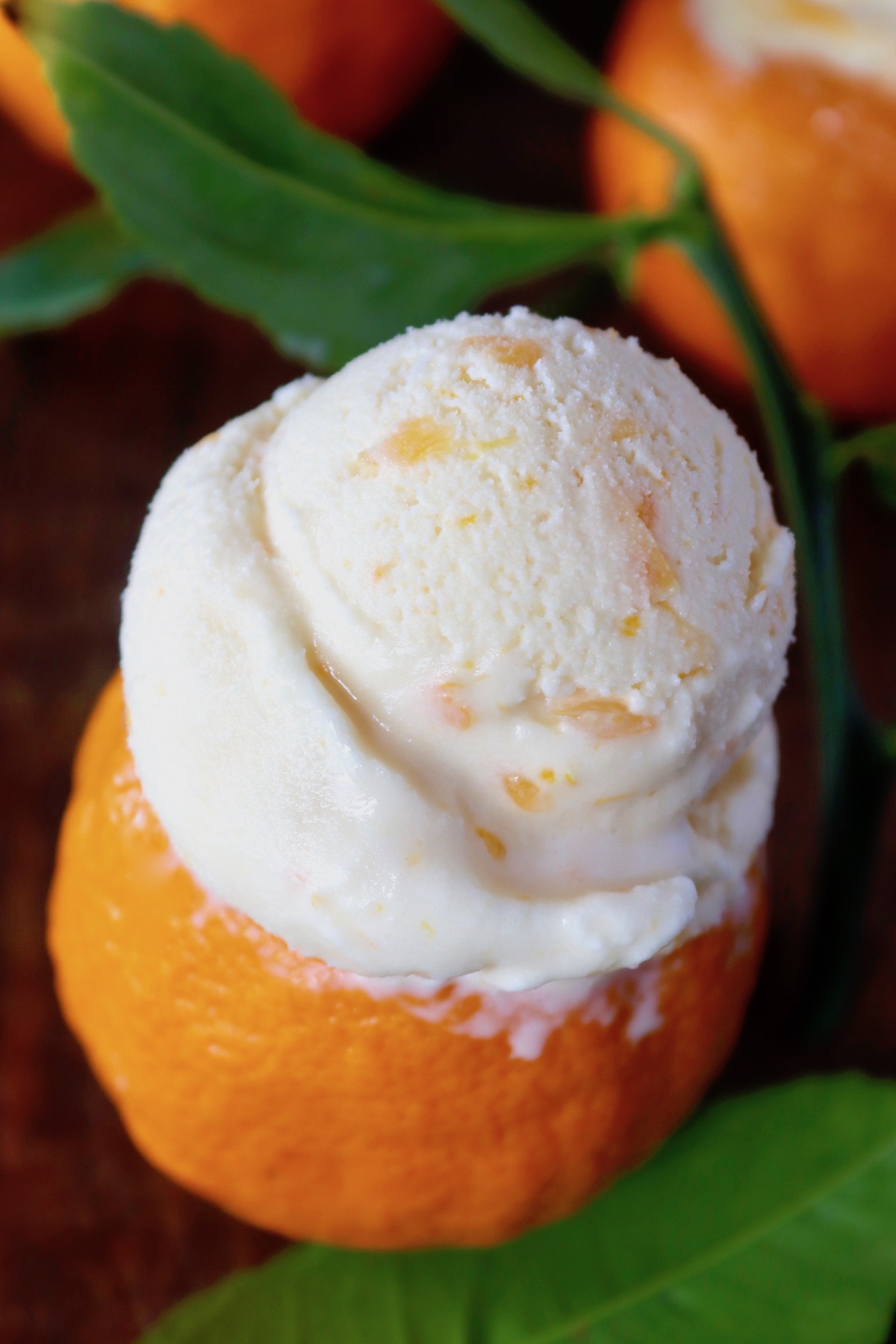 Tangerine peel bowl full with tangerine ice cream.