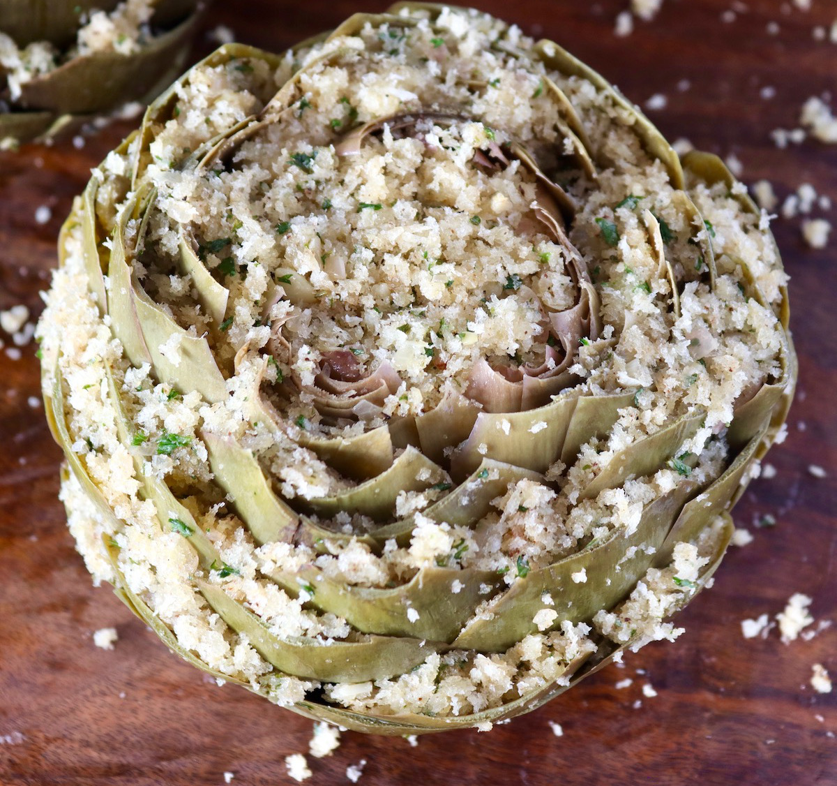 Top view of big artichoke with breadcrumb stuffing.